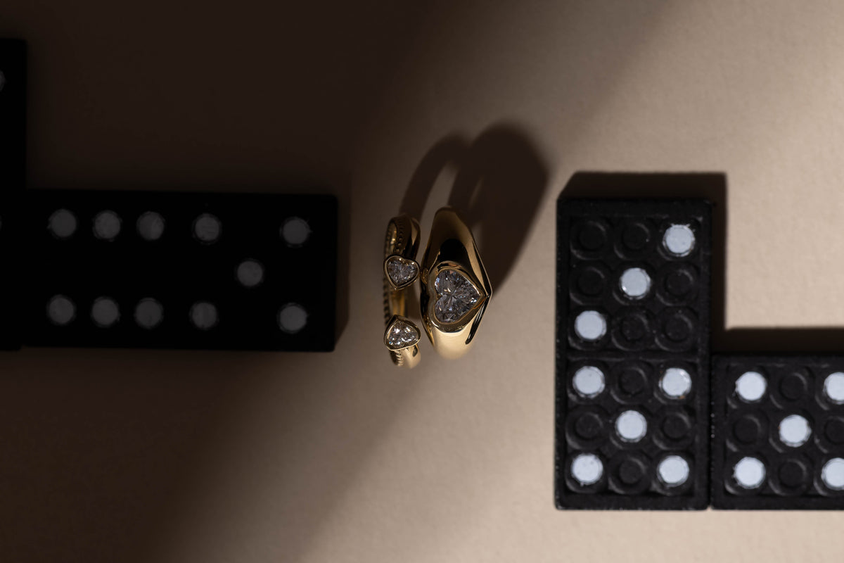 MATCH Hearts and heart signet rings beside dominoes