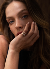 Close-up of a model wearing the MATCH Drops Ring alongside another ring