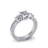 A Princess Cut Center Diamond Engegmant Ring, Accompanied with A Round Brilliant Cut Diamonds & White Gold Ring by DANA ARISH.